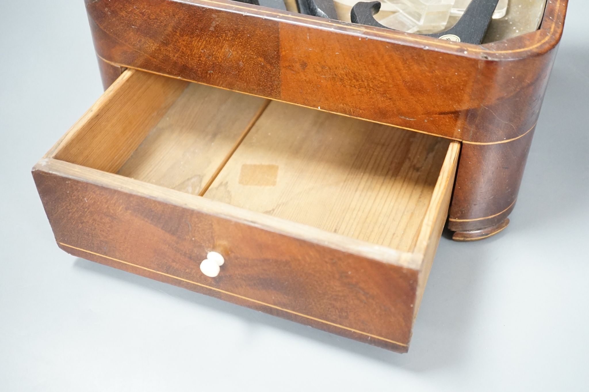 A 19th century satinwood strung mahogany stick stand with fitted drawer, 54 cms high.